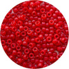 A close-up view of small, bright red pony beads scattered on a white background.