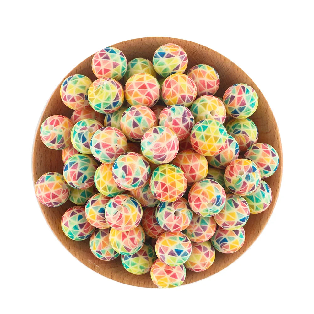 A bowl filled with colorful, translucent silicone beads for jewelry making.