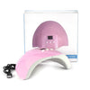 A pink clear UV resin glue device with a dome-shaped applicator is shown in its packaging.