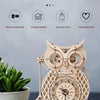 A detailed wooden owl wall clock made from a DIY assembly kit, featuring intricate gears and a natural wood finish.