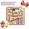 A magnetic maze puzzle board with colored beads and U-shaped tracks for practicing color matching and hand-eye coordination.
