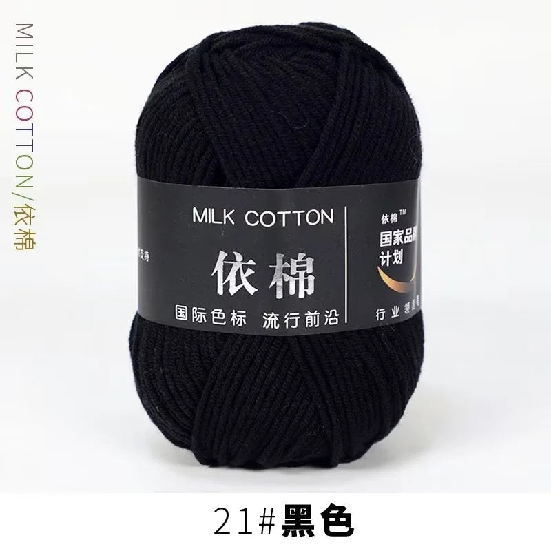 A skein of black milk cotton yarn for knitting and crochet