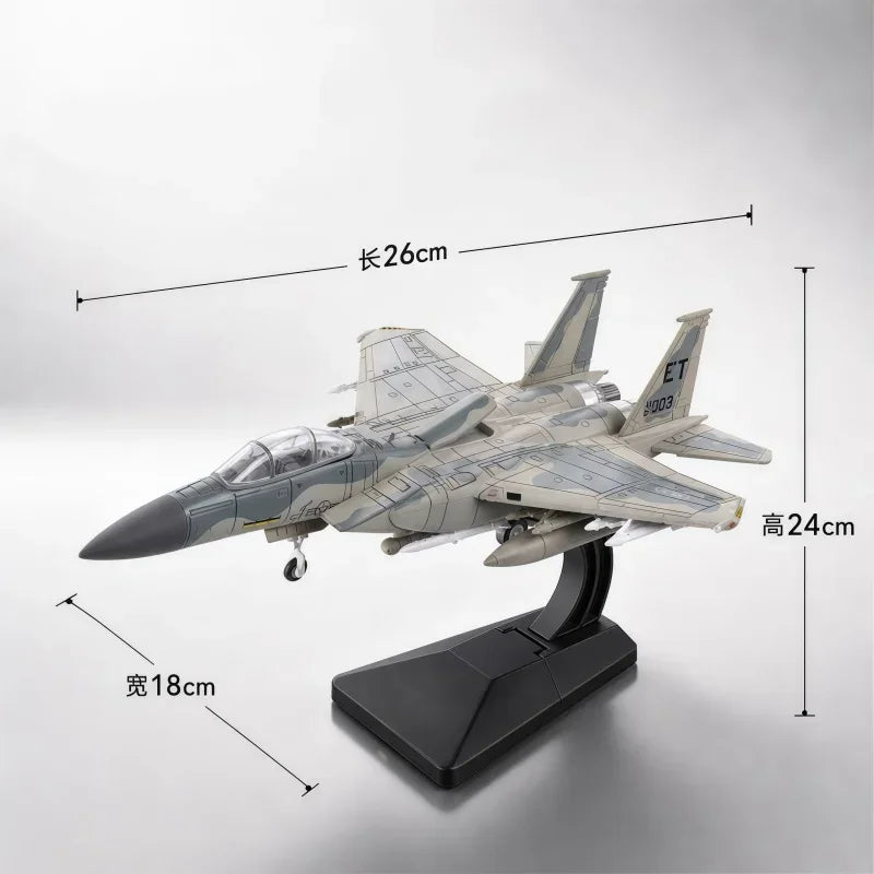 A model kit of an F-15 Eagle fighter jet displayed on a black stand.
