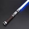 A premium metal lightsaber with a blue blade and a dark brown grip is shown diagonally against a dark background.