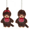 A brown Monchhichi plush toy with a red bow, shown as a keychain.