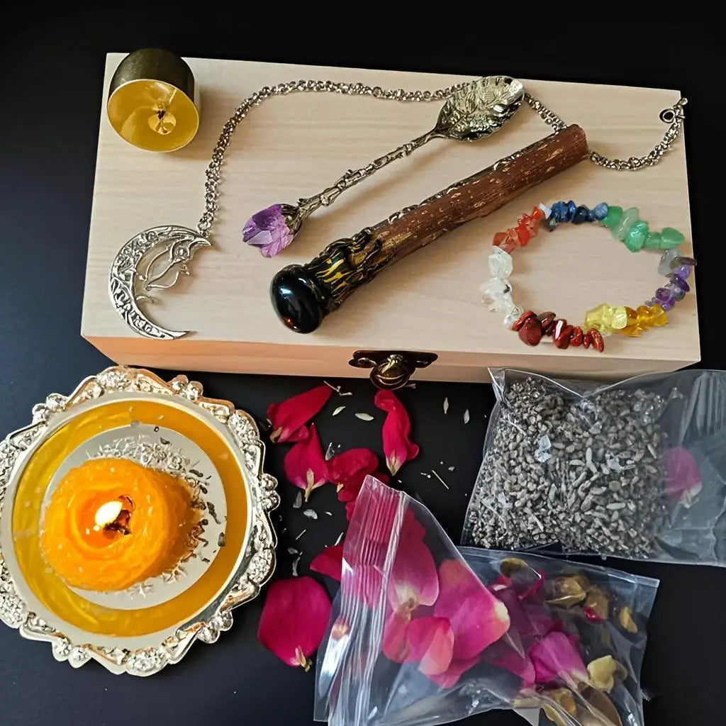 A witchcraft starter kit displayed on a wooden box featuring crystals, herbs, and an oil lamp.