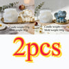 Two white elephant silicone molds for candle soap and resin crafts with accompanying candles.