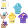 A set of three scented butter slime containers featuring dinosaur and cake designs in blue, yellow, and purple.