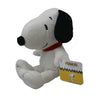 A white Snoopy plush toy with black ears and a red collar sitting down.