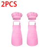 A pair of pink kids' chef apron and hat set displayed side by side.