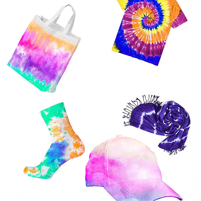 A collection of colorful textile fabric dye powder products including a tote bag, a t-shirt, a sock, and a pink baseball cap.