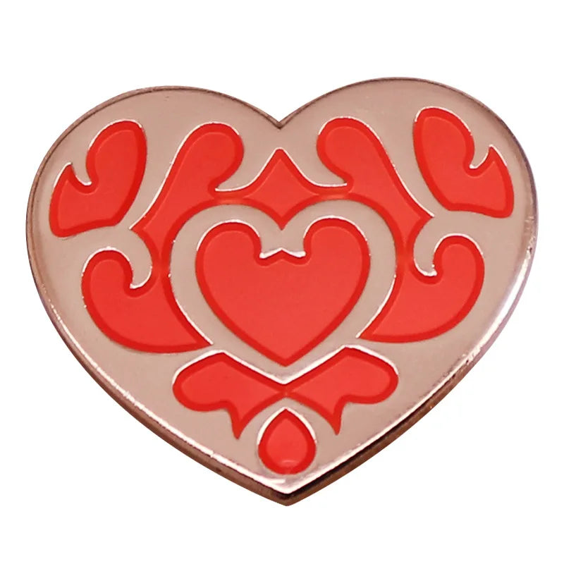 A heart-shaped enamel pin brooch featuring a red and pink floral design.