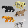 A set of six African wildlife animal building blocks including a black lion, yellow leopard, tan elephant, orange tiger, and 