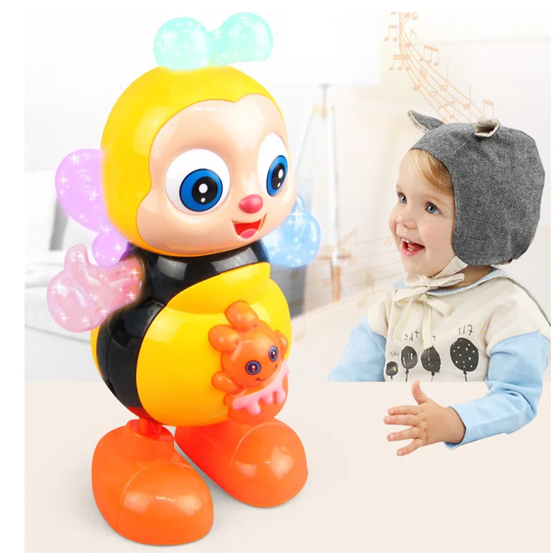 Un juguete musical de abeja bailarina amarillo y negro interactivo con ojos grandes y patas naranjas, junto a un bebé que lle