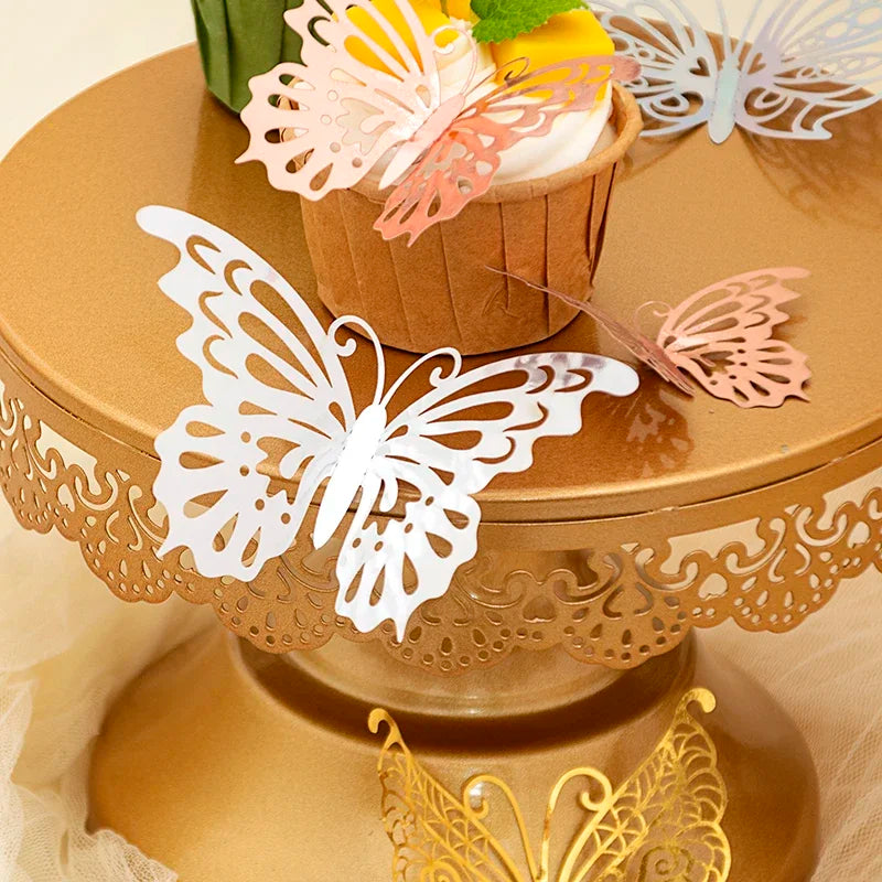Rose gold 3D butterfly wall stickers decorating a tiered stand with edible flowers and decorative butterflies