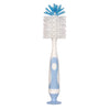 A white baby bottle cleaning brush with blue bristles and a suction stand.
