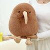 A brown kiwi bird plush toy with a long beak is being held by a person.