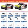 A set of spare parts for an FMS 1/18 Bronco RC car, including various components like chassis and body pieces.