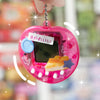 A pink decorative cut film sticker set with a digital screen and a purple star charm is held by a hand.