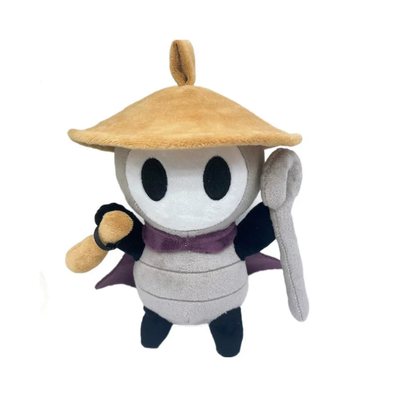 A plush doll of the character Sherma from Hollow Knight Silksong featuring a tan hat and dark purple accents.