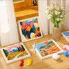 A collection of colorful flower pattern punch needle embroidery kits displayed on a wooden table.