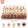 A pack of 35 plush fur pom pom beads in various colors and shades for jewelry making