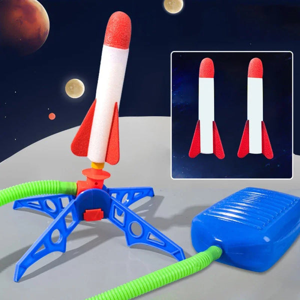 A toy rocket launcher set with a white and red rocket, blue base, and green tubing against a dark background.