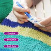 Hands are using a blue crochet hook to work with light-colored yarn on a textured mat.