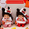 A cute Monchhichi plush doll with black fur and white accents is shown against a red background.