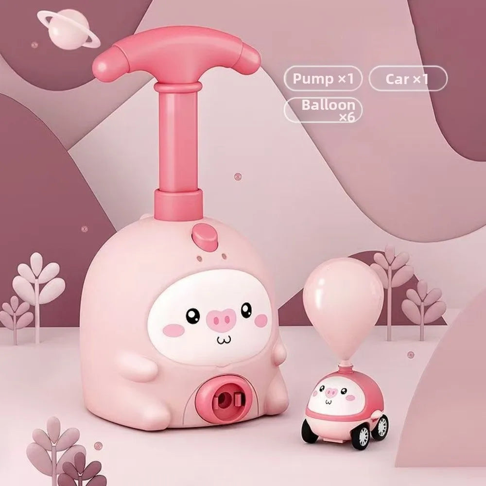 A pink balloon-powered racing car toy with a launcher and six balloons is shown on a light background.