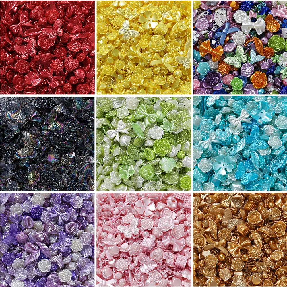 A collection of colorful butterfly shell acrylic beads in various shades including red, yellow, purple, green, and gold.
