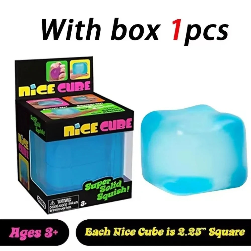 A box of Nice Cube squishy stress toys with one blue cube visible.