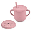 A pink BPA-free silicone snack cup with a lid and a matching silicone plate for babies and toddlers.