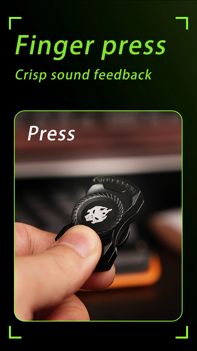 A hand presses a black magnetic fidget spinner with push buttons for crisp sound feedback.