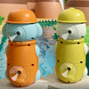 Two bath toys shaped like a duck and an elephant with suction cup waterwheels in orange and yellow colors.