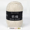 A ball of cream colored milk cotton yarn labeled with Chinese characters and the brand YIMIAN