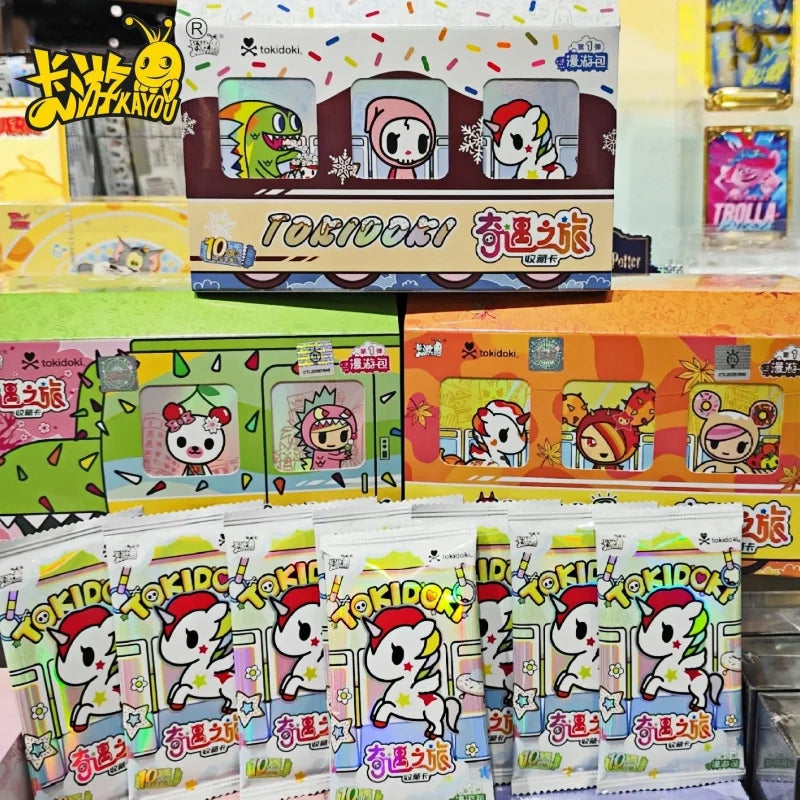 A box of Tokidoki Unicorn Adventure Journey Series Vol.1 collectible cards featuring various unicorn characters.