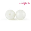 Two white soft silicone beads are shown against a white background.