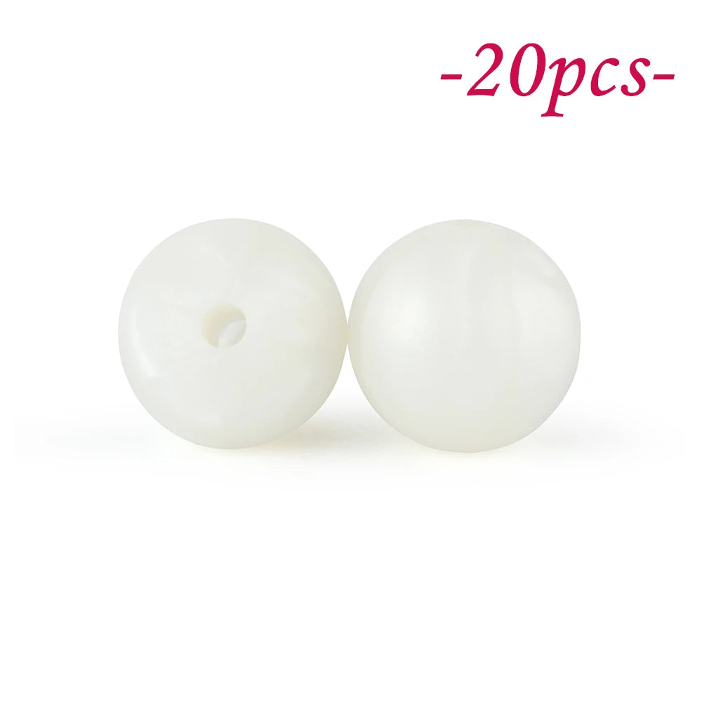 Two white soft silicone beads are shown against a white background.