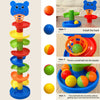 An interactive ball tower with colored balls and a drop mechanism used for play.