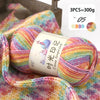 A ball of multi-colored gradient acrylic yarn is shown next to a swatch of knitted fabric.