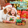 A child is holding a green electric steam train toy with lights and sounds in front of a Christmas background.