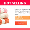 A stack of pink and orange yarn balls for knitting and crochet projects.
