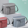 A gray Insular stroller bag with a separate organizer pouch is displayed on a white surface.