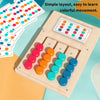 A wooden color matching puzzle game showing various colored discs and a layout for learning movement.