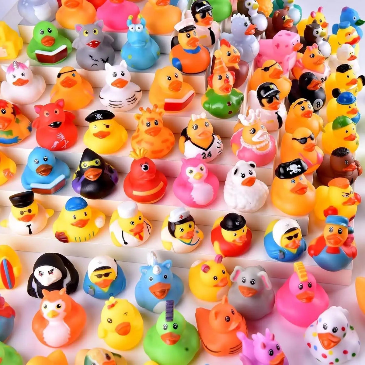 A collection of colorful rubber ducks in various shapes and colors used as party favors or bath toys.