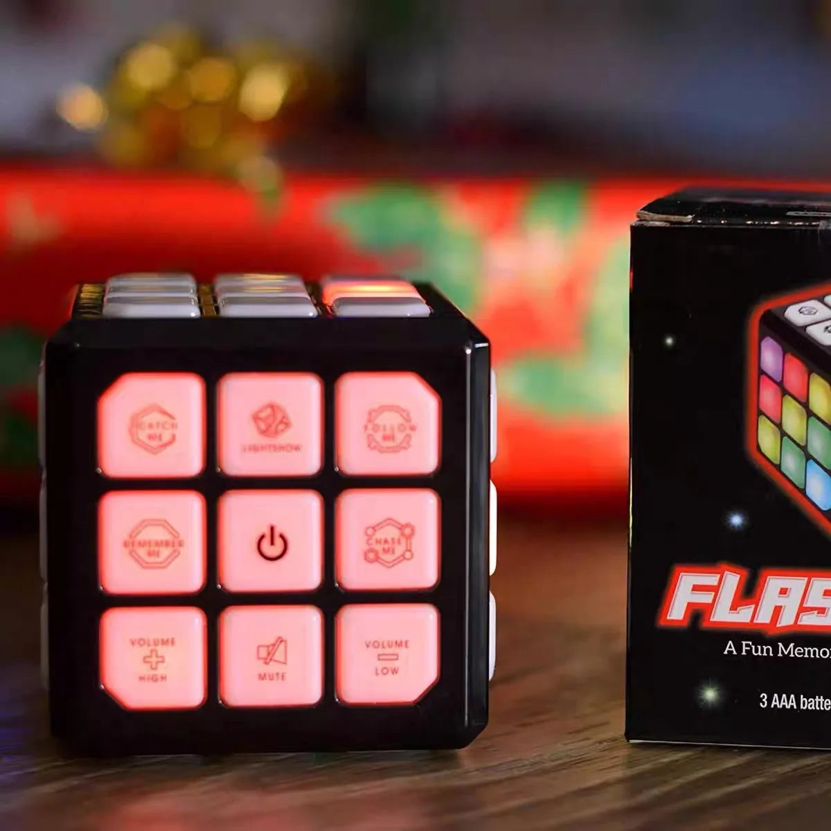 A black musical brain teaser cube with flashing lights resting on a wooden surface.