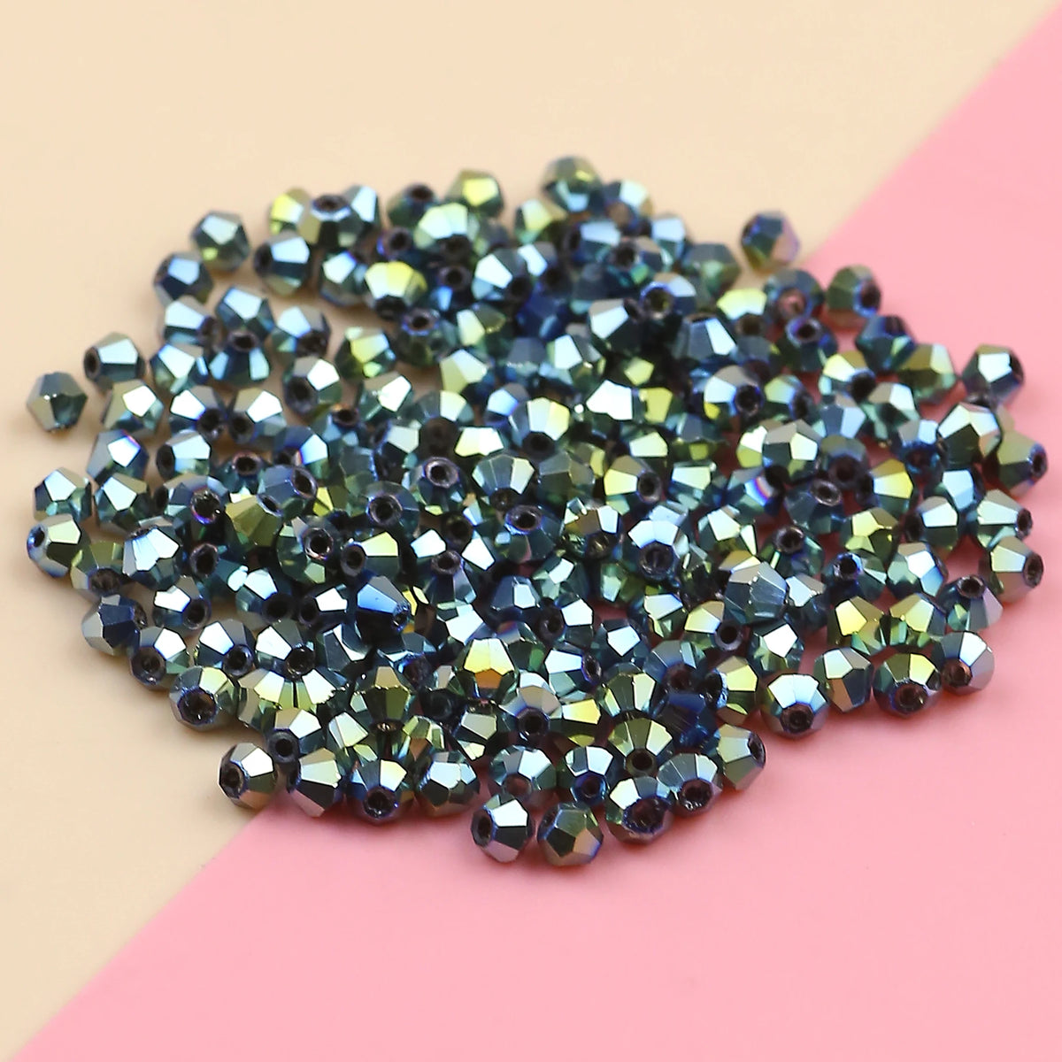 A pile of dark blue and purple electroplated crystal glass beads for jewelry making