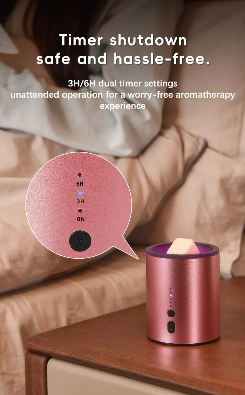 A pink electric wax melt heater is shown on a wooden surface next to a blurred background of bedding.