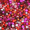 Multicolor round crystal glass beads in shades of red, pink, and purple for jewelry making